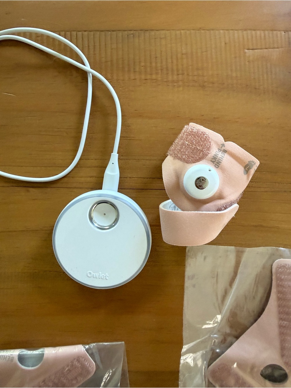 Owlet Smart Wearable Charging Dock with Pink Sensor Strap